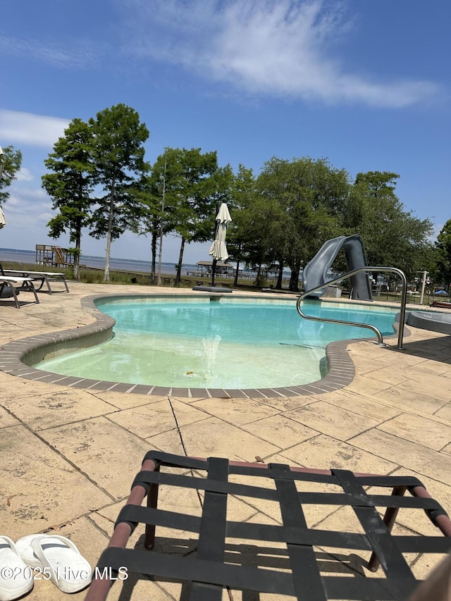 2270 Bella Coola Rd, Lake Waccamaw, NC 28450 - swimming pool featuring a water slide and a patio area