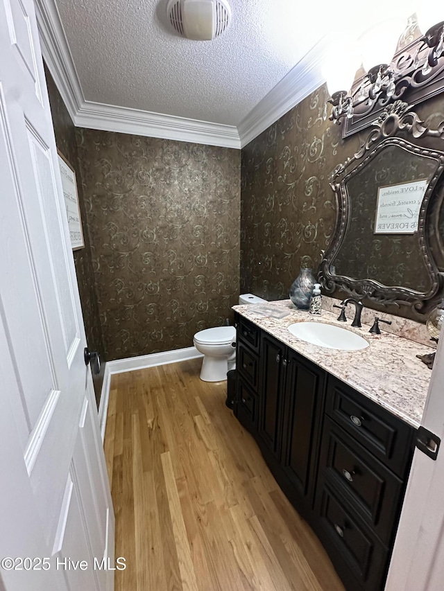 2270 Bella Coola Rd, Lake Waccamaw, NC 28450 - bathroom with ornamental molding, vanity, wood finished floors, wallpapered walls, and a textured ceiling