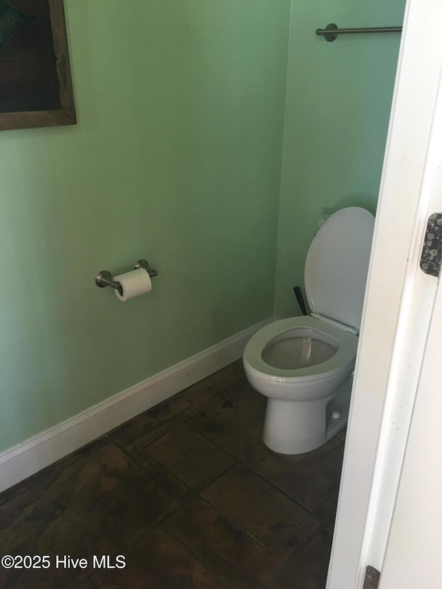 2270 Bella Coola Rd, Lake Waccamaw, NC 28450 - bathroom with toilet and tile patterned floors