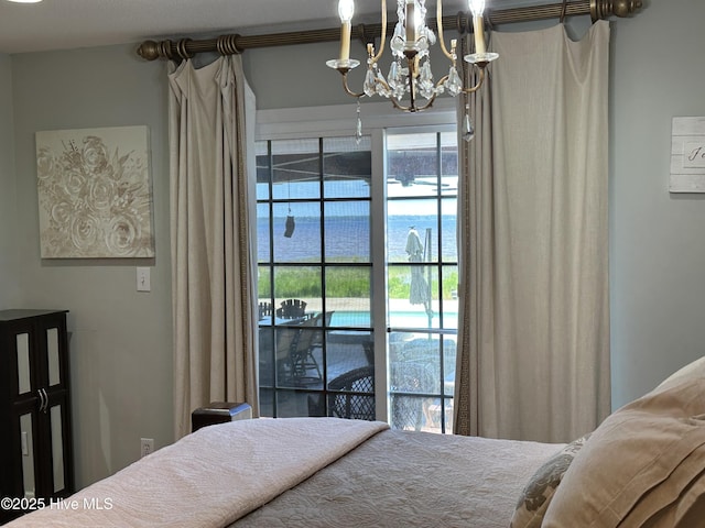 2270 Bella Coola Rd, Lake Waccamaw, NC 28450 - bedroom featuring a chandelier