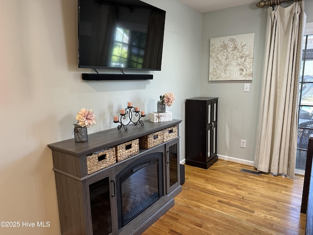 2270 Bella Coola Rd, Lake Waccamaw, NC 28450 - bar area featuring light wood finished floors and baseboards
