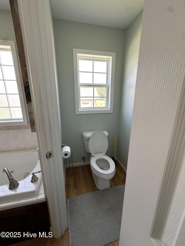 2270 Bella Coola Rd, Lake Waccamaw, NC 28450 - bathroom featuring wood finished floors and a whirlpool tub
