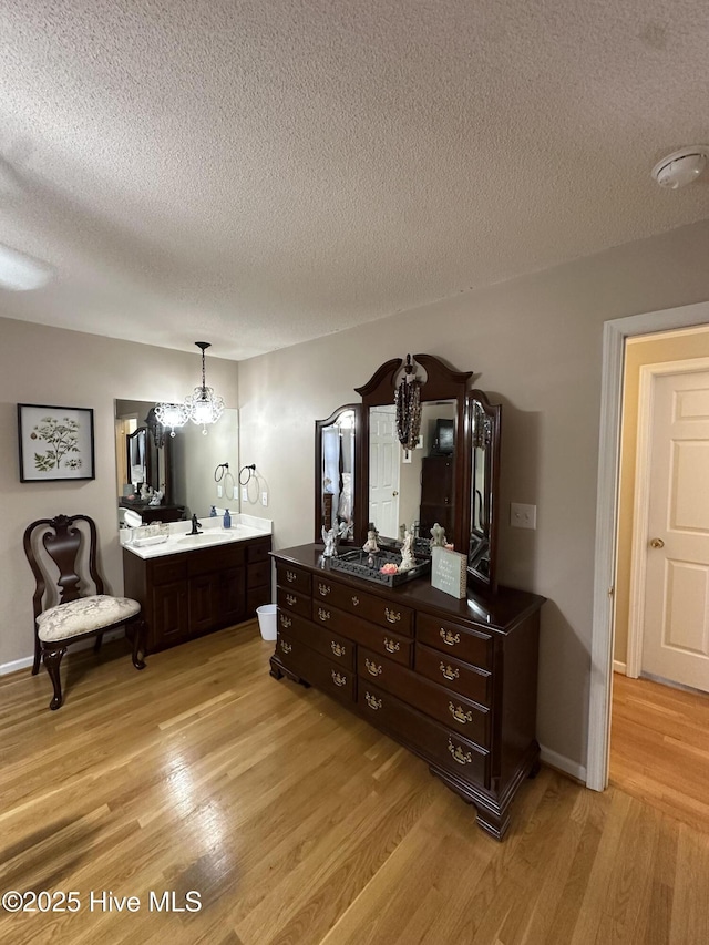 2270 Bella Coola Rd, Lake Waccamaw, NC 28450 - bedroom featuring light wood-style floors and a textured ceiling