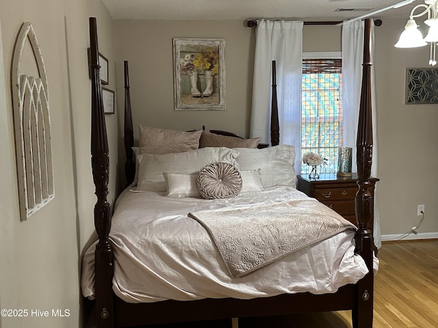 2270 Bella Coola Rd, Lake Waccamaw, NC 28450 - bedroom featuring wood finished floors and baseboards