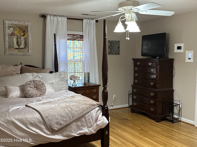 2270 Bella Coola Rd, Lake Waccamaw, NC 28450 - bedroom featuring wood finished floors and a ceiling fan