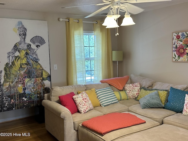 2270 Bella Coola Rd, Lake Waccamaw, NC 28450 - living room featuring a ceiling fan, wood finished floors, and a textured ceiling