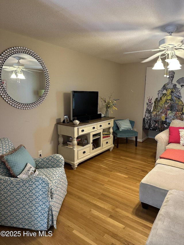 2270 Bella Coola Rd, Lake Waccamaw, NC 28450 - living area with a ceiling fan, wood finished floors, and a textured ceiling