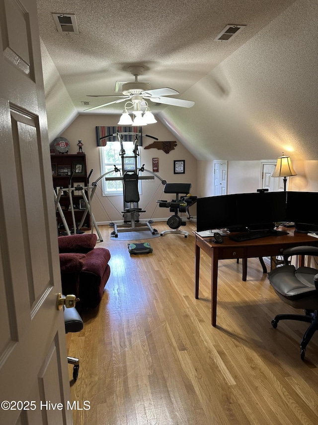 2270 Bella Coola Rd, Lake Waccamaw, NC 28450 - home office featuring a textured ceiling, light wood finished floors, lofted ceiling, and a ceiling fan
