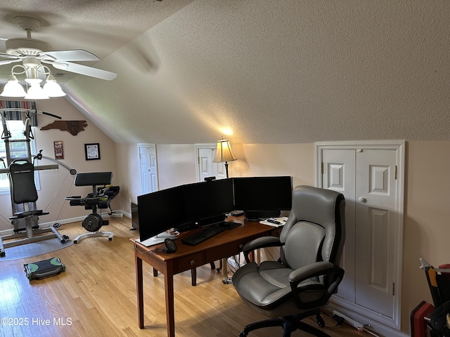 2270 Bella Coola Rd, Lake Waccamaw, NC 28450 - home office with a ceiling fan, a textured ceiling, vaulted ceiling, and light wood-type flooring