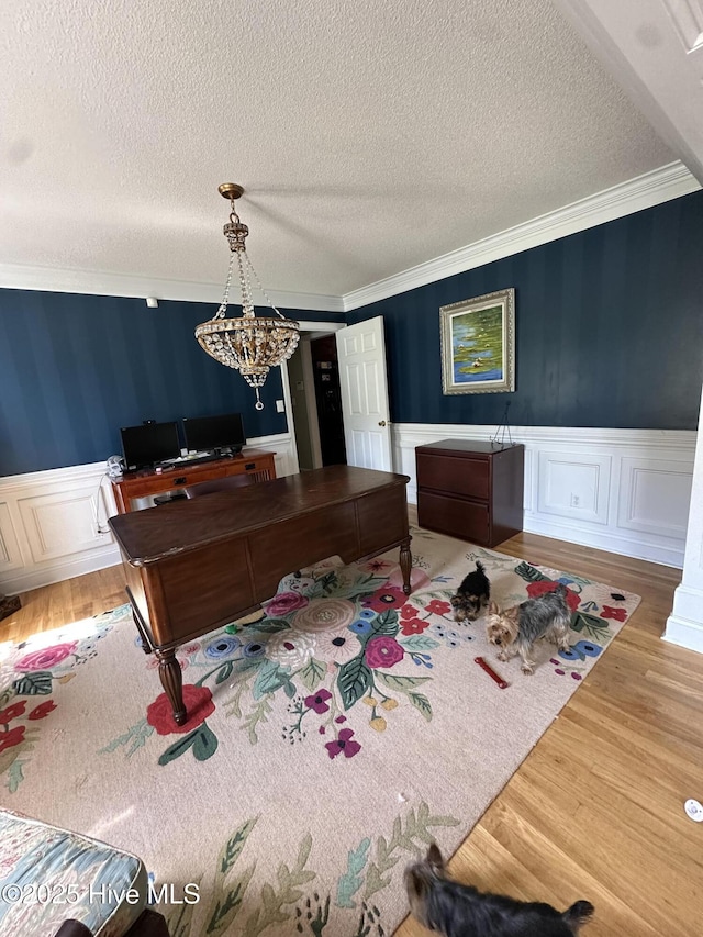 2270 Bella Coola Rd, Lake Waccamaw, NC 28450 - recreation room with crown molding, a textured ceiling, a wainscoted wall, wood finished floors, and a desk