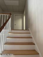 102 W Eden St, Edenton, NC 27932 - stairway featuring a paneled ceiling