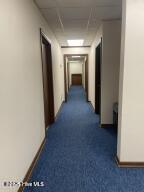 102 W Eden St, Edenton, NC 27932 - corridor with dark colored carpet and a drop ceiling