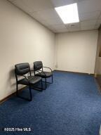 102 W Eden St, Edenton, NC 27932 - unfurnished room featuring dark colored carpet and a paneled ceiling