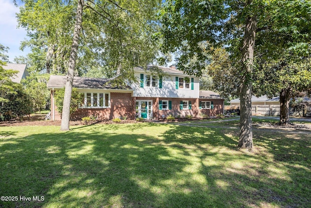 604 W Wilson Creek Dr, Trent Woods, NC 28562 - view of front facade featuring brick siding and a front yard