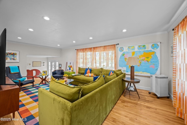 604 W Wilson Creek Dr, Trent Woods, NC 28562 - living room featuring recessed lighting, ornamental molding, light wood-style flooring, and radiator heating unit