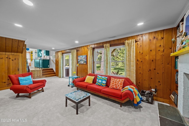 604 W Wilson Creek Dr, Trent Woods, NC 28562 - carpeted living room featuring a fireplace, wooden walls, stairs, and recessed lighting