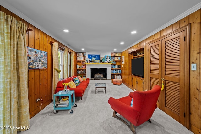604 W Wilson Creek Dr, Trent Woods, NC 28562 - carpeted living area with wooden walls, ornamental molding, recessed lighting, and a fireplace