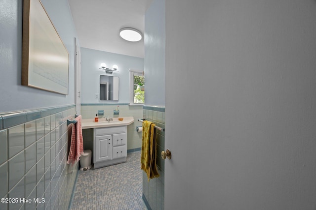 604 W Wilson Creek Dr, Trent Woods, NC 28562 - bathroom with tile walls, vanity, a wainscoted wall, and tile patterned flooring