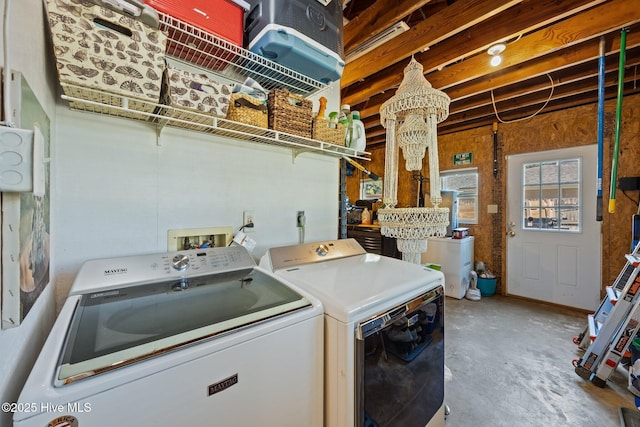 604 W Wilson Creek Dr, Trent Woods, NC 28562 - laundry room with washer and clothes dryer and a chandelier