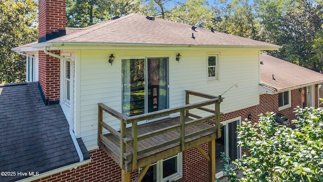 604 W Wilson Creek Dr, Trent Woods, NC 28562 - back of house featuring a chimney, brick siding, and a deck