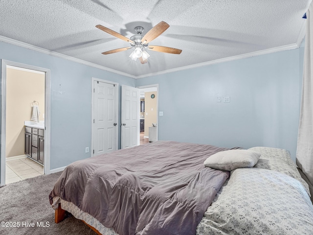 165 Parnell Rd, Hubert, NC 28539 - bedroom featuring light carpet, ornamental molding, ensuite bath, light tile patterned floors, and a ceiling fan