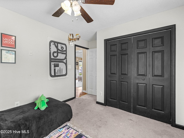 165 Parnell Rd, Hubert, NC 28539 - carpeted bedroom with a chandelier, ceiling fan, and a closet