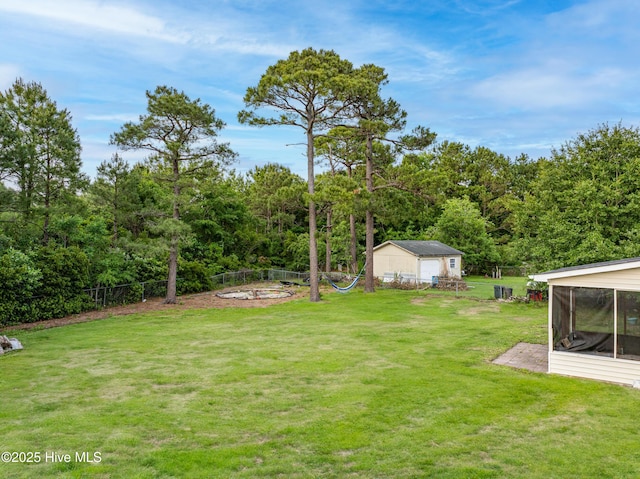 165 Parnell Rd, Hubert, NC 28539 - view of yard with a sunroom and an outdoor structure