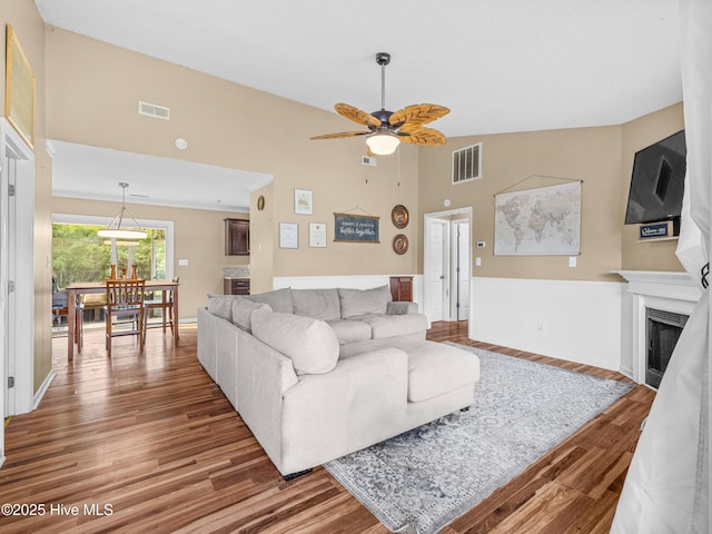 165 Parnell Rd, Hubert, NC 28539 - living area featuring wood finished floors, a ceiling fan, and a fireplace