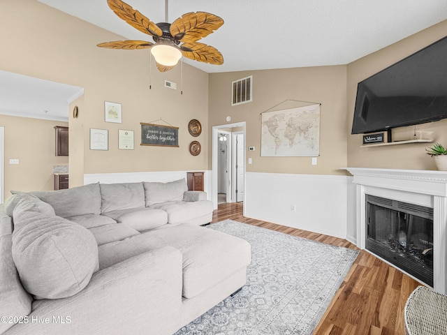 165 Parnell Rd, Hubert, NC 28539 - living area with ceiling fan, wood finished floors, high vaulted ceiling, and a fireplace