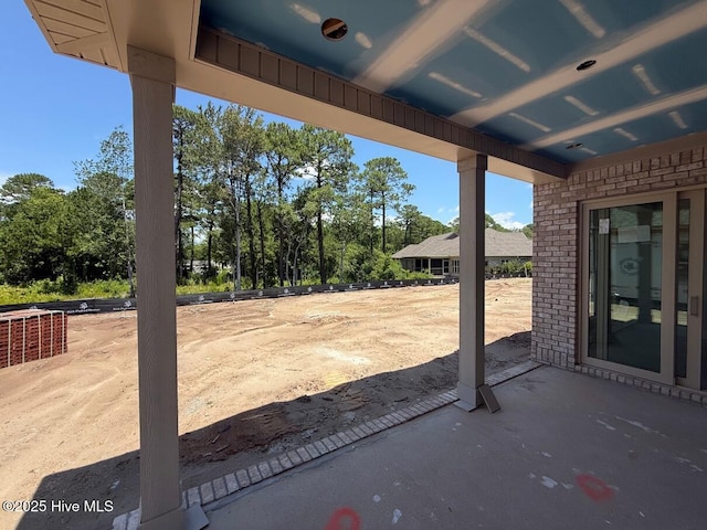 453 Motts Forest Rd Unit 70, Wilmington, NC 28412 - view of patio featuring view of wooded area