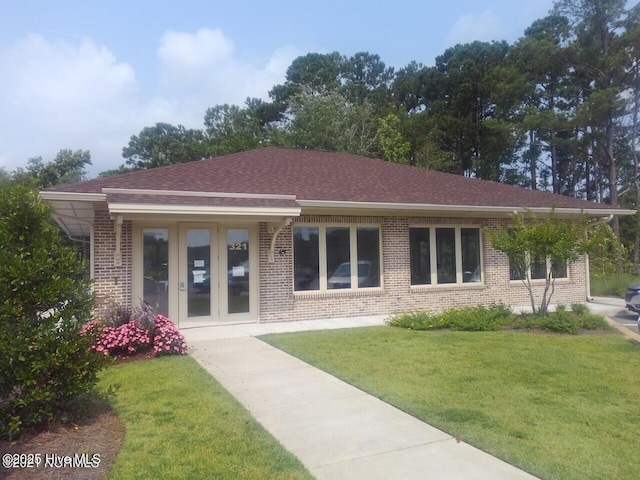 453 Motts Forest Rd Unit 70, Wilmington, NC 28412 - rear view of property with brick siding, a lawn, french doors, and roof with shingles
