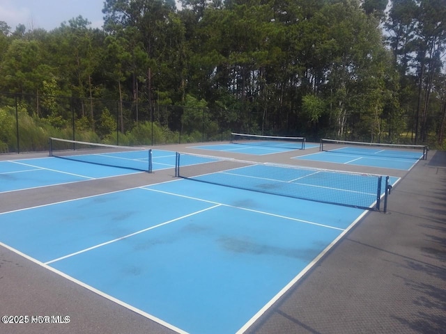 453 Motts Forest Rd Unit 70, Wilmington, NC 28412 - view of tennis court with community basketball court and a forest view