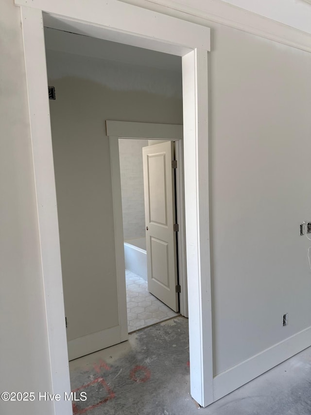 453 Motts Forest Rd Unit 70, Wilmington, NC 28412 - hallway featuring unfinished concrete flooring