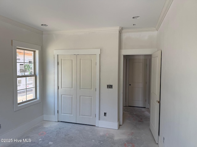 453 Motts Forest Rd Unit 70, Wilmington, NC 28412 - unfurnished bedroom featuring concrete flooring, crown molding, and a closet