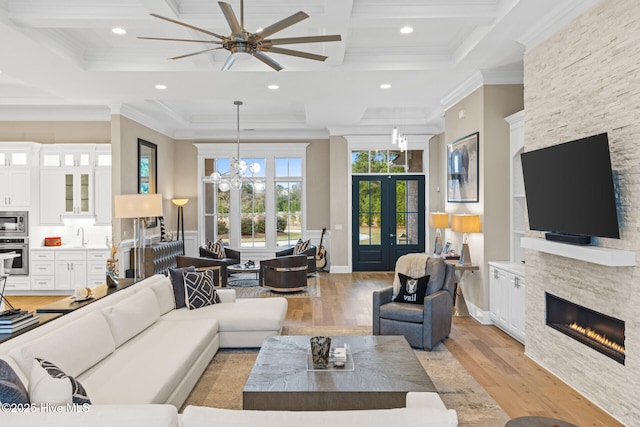 805 Wild Turkey Pl, Wilmington, NC 28405 - living room with a stone fireplace, coffered ceiling, light wood-type flooring, ceiling fan, and recessed lighting