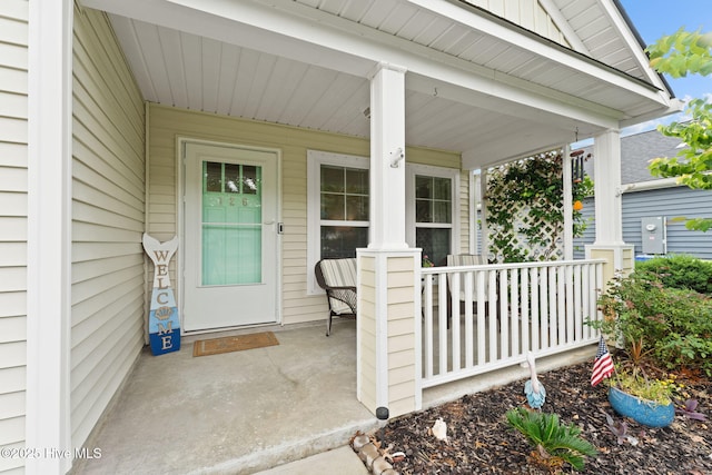 126 NW 14th St, Oak Island, NC 28465 - property entrance with a porch
