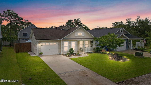 126 NW 14th St, Oak Island, NC 28465 - view of front of home with driveway, a garage, covered porch, and a shingled roof