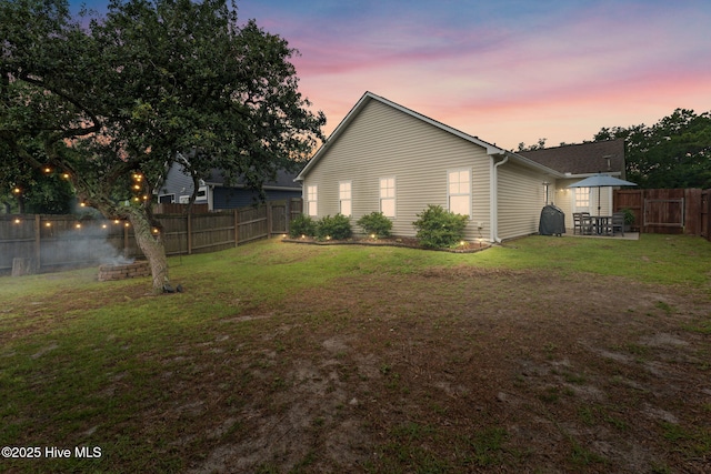 126 NW 14th St, Oak Island, NC 28465 - back of house featuring a fenced backyard and a patio area
