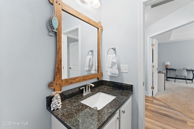 126 NW 14th St, Oak Island, NC 28465 - bathroom featuring vanity and wood finished floors