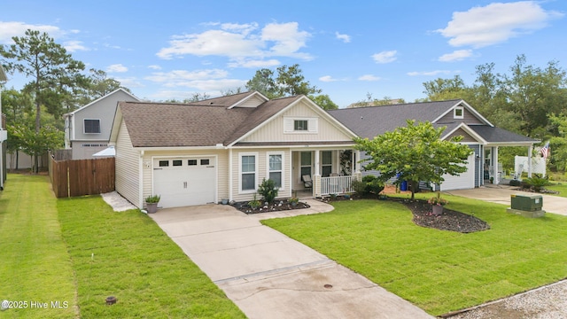 126 NW 14th St, Oak Island, NC 28465 - view of front facade featuring driveway, covered porch, a garage, a shingled roof, and board and batten siding