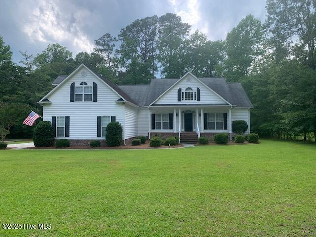 1700 Pennyroyal Rd, New Bern, NC 28562 - view of front of home with covered porch and a front yard