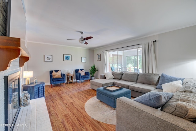 3921 Westover Rd, Wilmington, NC 28403 - living area with wood finished floors, ornamental molding, ceiling fan, and a glass covered fireplace