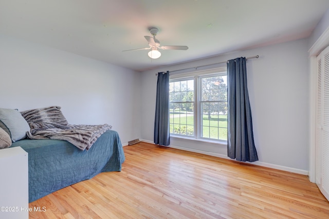 3921 Westover Rd, Wilmington, NC 28403 - bedroom with light wood finished floors, a closet, and ceiling fan