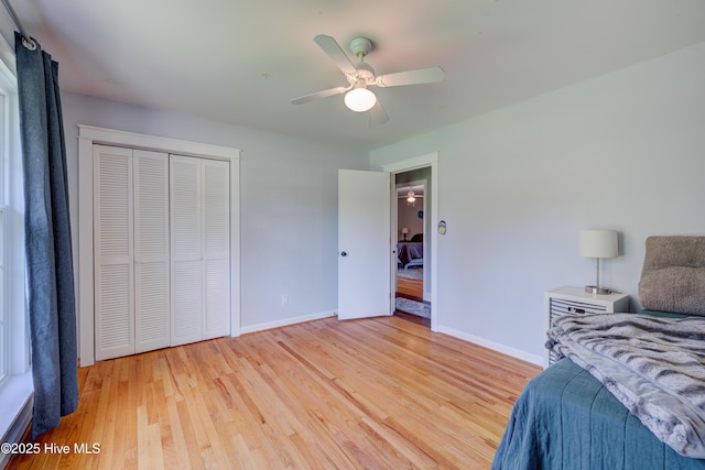 3921 Westover Rd, Wilmington, NC 28403 - bedroom featuring light wood-style floors, a closet, and a ceiling fan