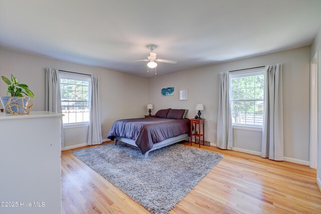 3921 Westover Rd, Wilmington, NC 28403 - bedroom with multiple windows, wood finished floors, and a ceiling fan