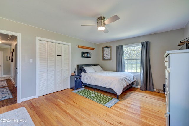 3921 Westover Rd, Wilmington, NC 28403 - bedroom with light wood-style floors, attic access, a closet, and a ceiling fan