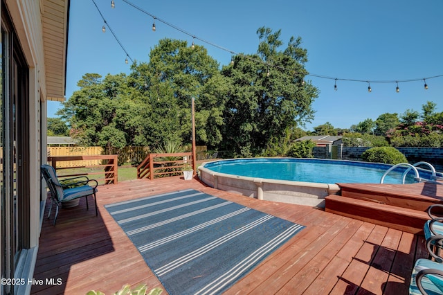 3921 Westover Rd, Wilmington, NC 28403 - outdoor pool featuring a fenced backyard and a deck