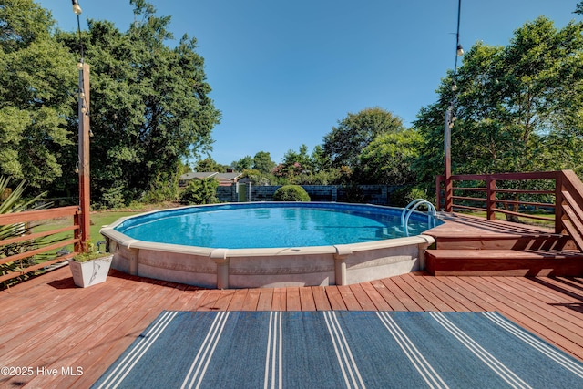 3921 Westover Rd, Wilmington, NC 28403 - view of pool with a deck and view of wooded area