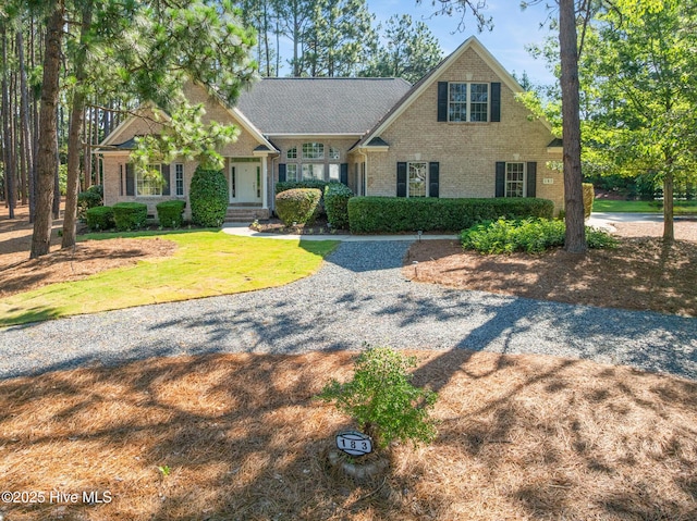 183 Baker Cir W, End, NC 27376 - view of front of property with brick siding and a front lawn