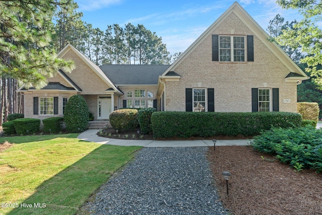 183 Baker Cir W, End, NC 27376 - view of front of house with brick siding and a front lawn